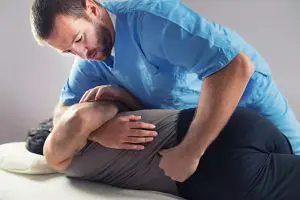 Therapist doing chiropractic treatment to patient at Houston, TX Therapist doing chiropractic treatment to patient at Houston, TX