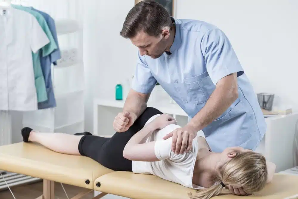 chiropractor doing the flexion technique to the patient