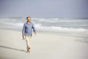 The old man walking on the beach at Houston, TX The old man walking on the beach at Houston, TX