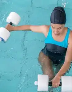 A patient receiving aquatic therapy in a pool