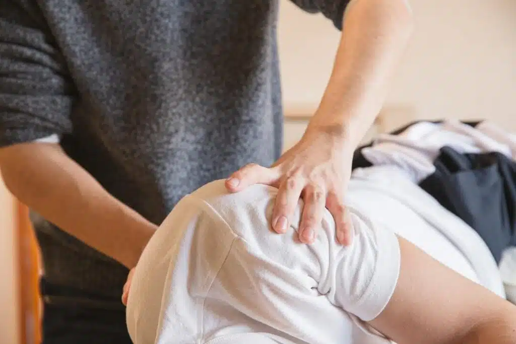 Patient receiving chiropractic adjustment due to work injury