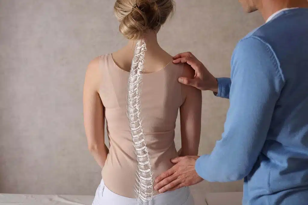Doctor examining the patients Spine