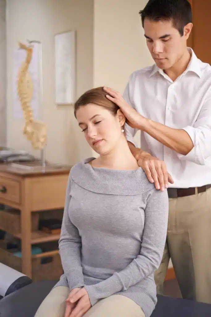 Chiropractor is doing some Active Release Technique to the patient with chronic neck pain