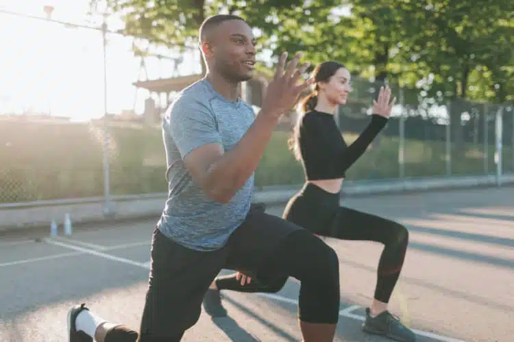 Athlete couple doing some outdoor exercises.